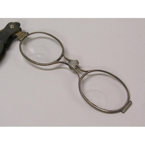 73 - A pair of Victorian lorgnette of gilt metal in a carved tortoiseshell case, 15cm l.