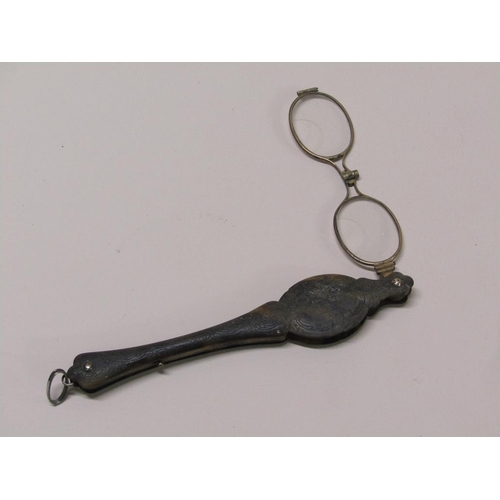 73 - A pair of Victorian lorgnette of gilt metal in a carved tortoiseshell case, 15cm l.