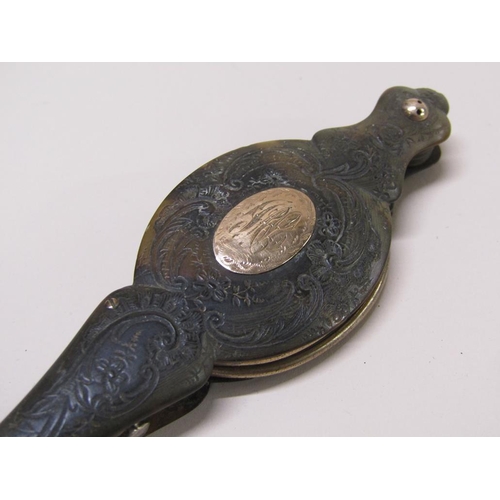 73 - A pair of Victorian lorgnette of gilt metal in a carved tortoiseshell case, 15cm l.