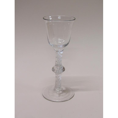 155 - An 18c wine glass with a bell shaped bowl on a double opaque white twist single knop stem with a sli... 