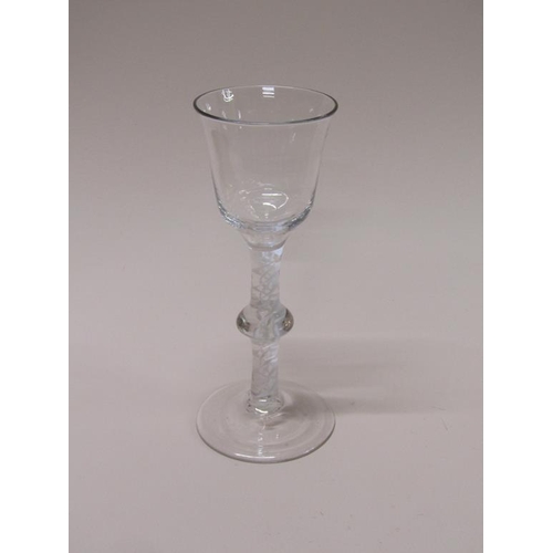 155 - An 18c wine glass with a bell shaped bowl on a double opaque white twist single knop stem with a sli... 