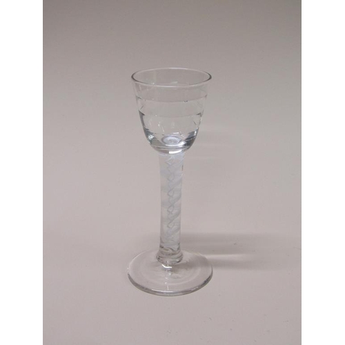 158 - An 18c wine cordial wine glass with a stepped circular banded bowl on a stem with a ten ply spiral b... 