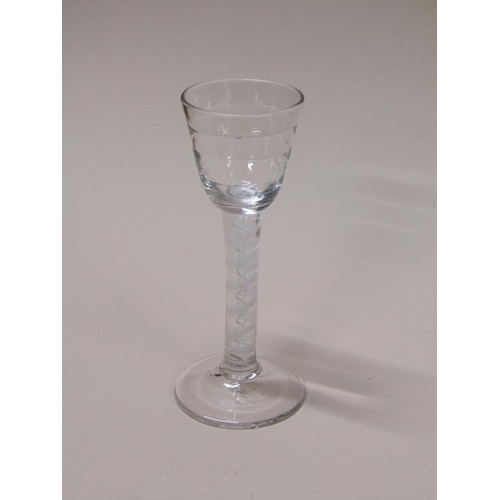 158 - An 18c wine cordial wine glass with a stepped circular banded bowl on a stem with a ten ply spiral b... 