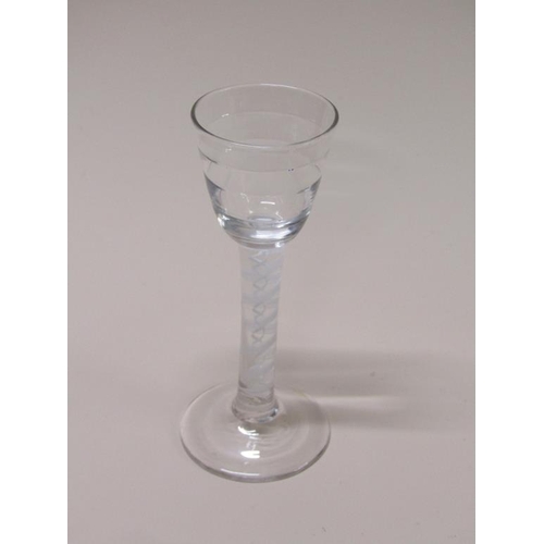 158 - An 18c wine cordial wine glass with a stepped circular banded bowl on a stem with a ten ply spiral b... 