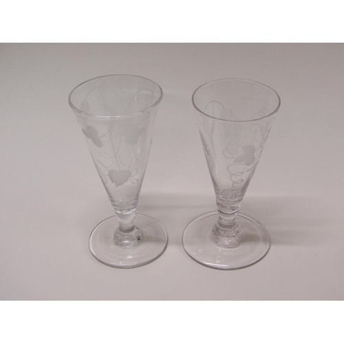 159 - Two late 18c wine flutes, the funnel bowls engraved with wheatear and grapes on short knopped stems ... 