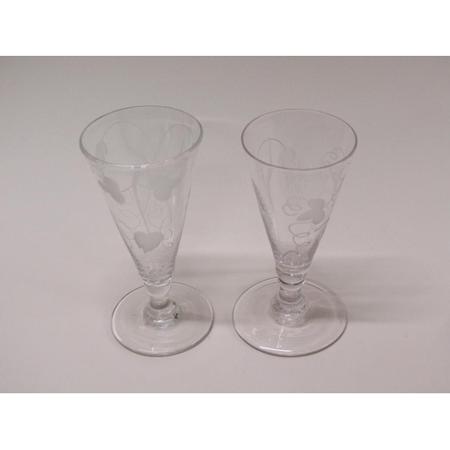 159 - Two late 18c wine flutes, the funnel bowls engraved with wheatear and grapes on short knopped stems ... 