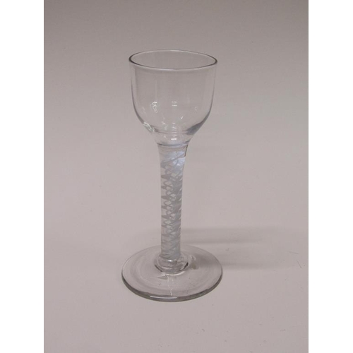 164 - An 18c cordial glass with a double series twist stem on a circular slightly domed base, 13.5cm h.