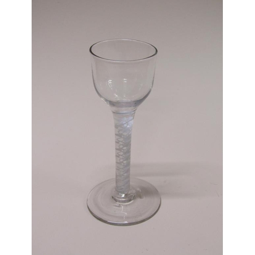 164 - An 18c cordial glass with a double series twist stem on a circular slightly domed base, 13.5cm h.