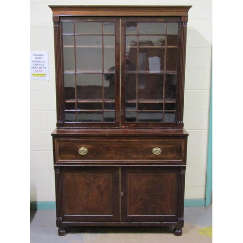 266 - A late Georgian figure mahogany secretaire bookcase, the upper section fitted shelves and enclosed b... 