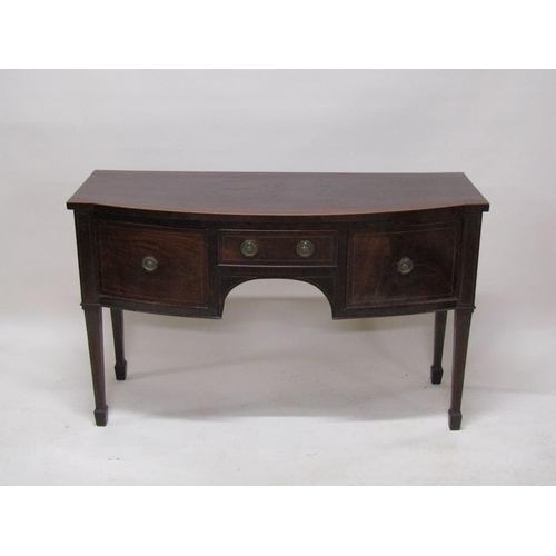 267 - An early 19c mahogany slight bow front sideboard fitted one central drawer over kneehole flanked by ... 