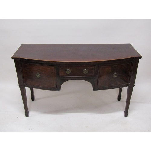 267 - An early 19c mahogany slight bow front sideboard fitted one central drawer over kneehole flanked by ... 