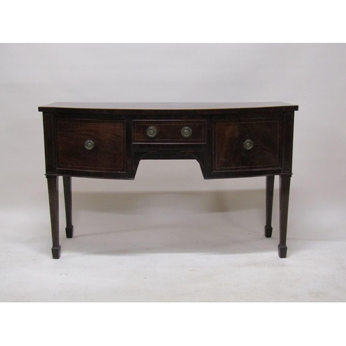 267 - An early 19c mahogany slight bow front sideboard fitted one central drawer over kneehole flanked by ... 