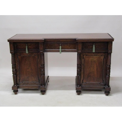 268 - A William IV mahogany pedestal sideboard, the slight breakfront top with gadrooned carved edge over ... 