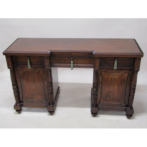 268 - A William IV mahogany pedestal sideboard, the slight breakfront top with gadrooned carved edge over ... 