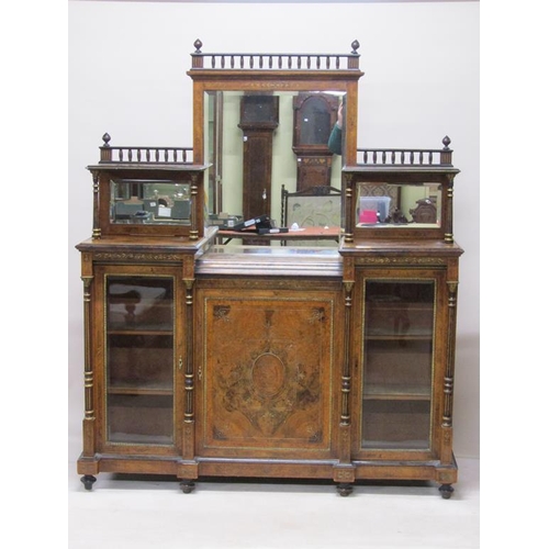 269 - A Victorian figured walnut mirrorback credenza, the mirrorback fitted two open shelves under a spind... 