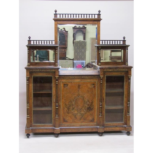 269 - A Victorian figured walnut mirrorback credenza, the mirrorback fitted two open shelves under a spind... 