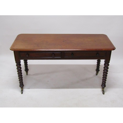 272 - A Victorian mahogany side table of rectangular form with moulded edge and rounded corners, having tw... 