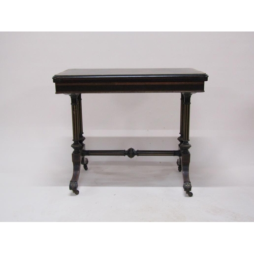 274 - A late Victorian ebonised and burr wood fold over card table of refectory form with beaded brass rai... 