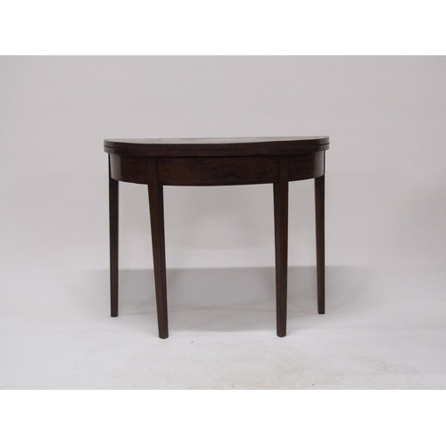 277 - A Regency mahogany demi lune fold over tea table with a deep frieze, satinwood line inlay and suppor... 