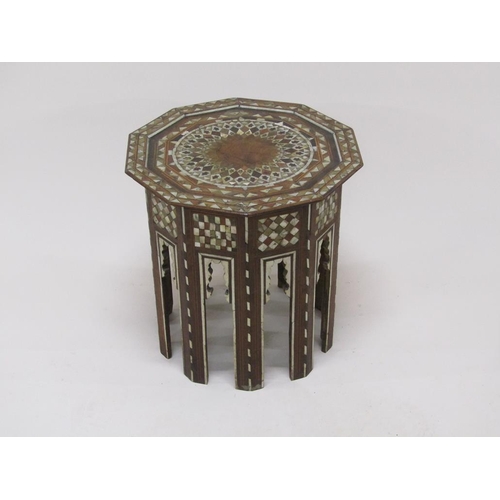 278 - A 19c Turkomen octagonal low table decorated with inlay and mother of pearl, 50cm w, 50cmh.