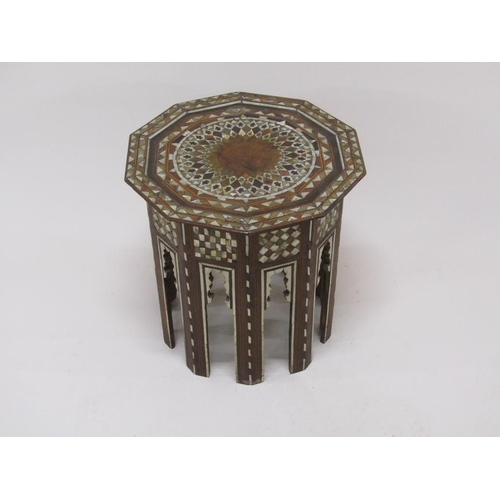 278 - A 19c Turkomen octagonal low table decorated with inlay and mother of pearl, 50cm w, 50cmh.