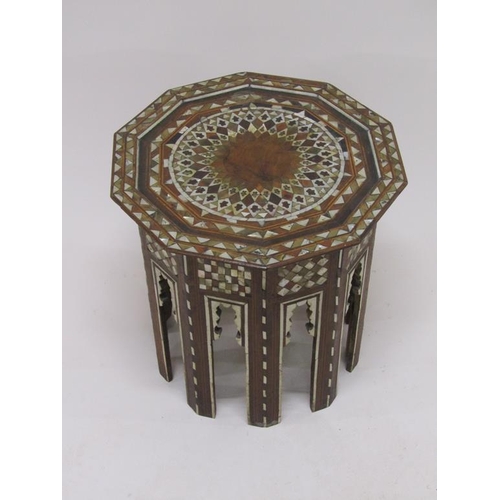 278 - A 19c Turkomen octagonal low table decorated with inlay and mother of pearl, 50cm w, 50cmh.