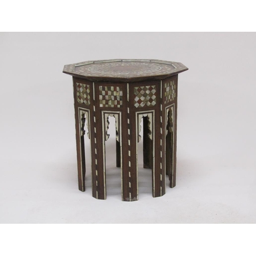 278 - A 19c Turkomen octagonal low table decorated with inlay and mother of pearl, 50cm w, 50cmh.