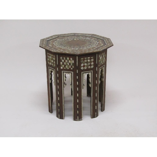 278 - A 19c Turkomen octagonal low table decorated with inlay and mother of pearl, 50cm w, 50cmh.