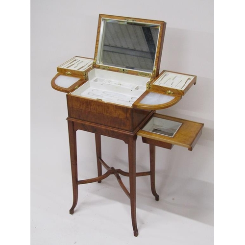 283 - An early 20c Asprey satinwood ladies dressing box, fitted but no tools, with rising mirrored cover a... 