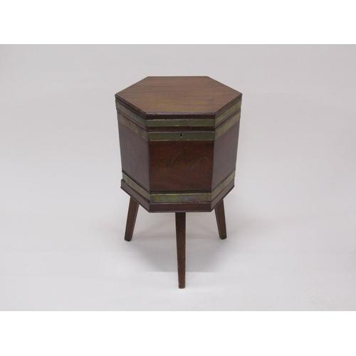 291 - A George III mahogany brass banded wine cellarette, lead lined and fitted with six compartments, sup... 