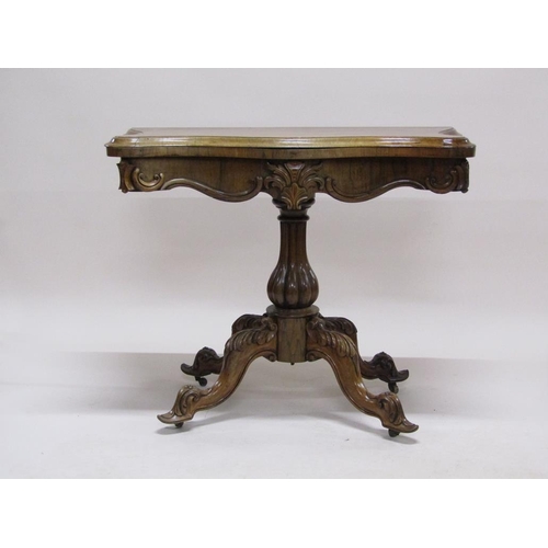 297 - A 19c rosewood pedestal fold over card table, the table top of serpentine form on a lobed baluster c... 