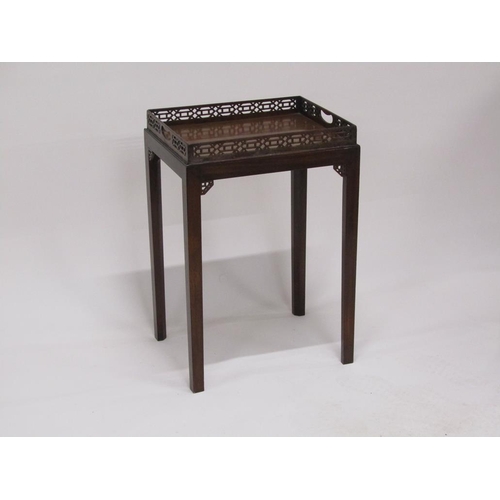 298 - A 19c figure mahogany tray top table, the tray top with a full pierced gallery on stand.