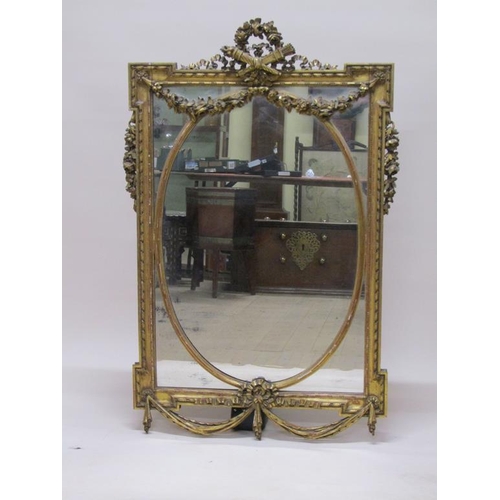 299 - A 19c gilt wood wall mirror of mid Georgian style, with oval central plate, 80cm x 131cm.