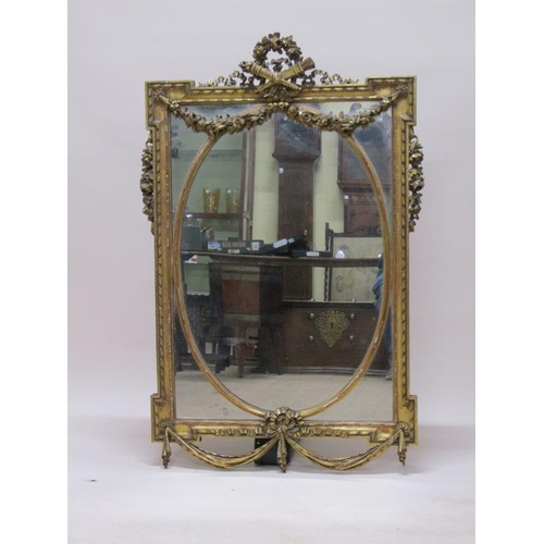 299 - A 19c gilt wood wall mirror of mid Georgian style, with oval central plate, 80cm x 131cm.