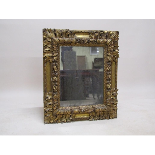 300 - A 19c, mid Georgian style, carved gilt wood and stucco wall mirror, 77cm x 93cm.