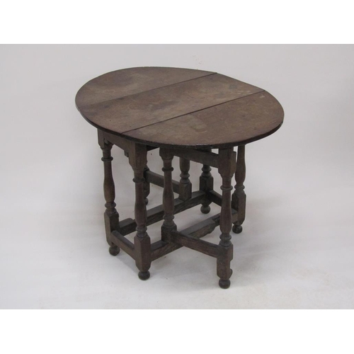 303 - An 18c oak twin flap oval gateleg table, 78cm w, 70cm h.