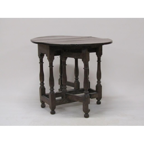 303 - An 18c oak twin flap oval gateleg table, 78cm w, 70cm h.