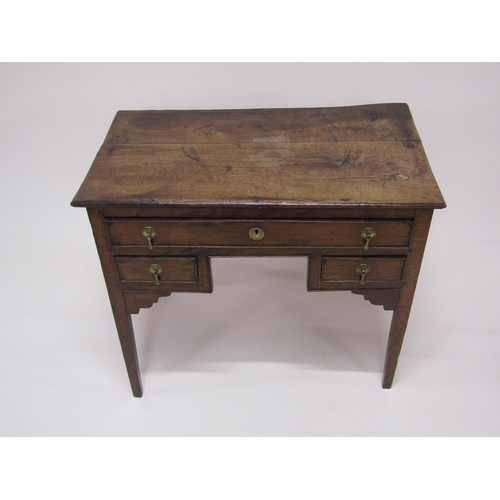 306 - A late Georgian oak and elm country lowboy of rectangular form with one long drawer over two short d... 