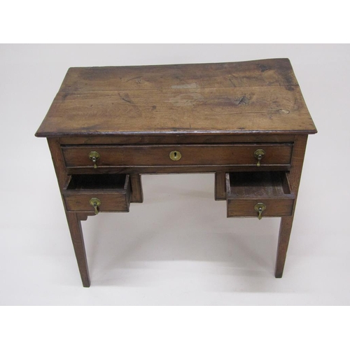 306 - A late Georgian oak and elm country lowboy of rectangular form with one long drawer over two short d... 