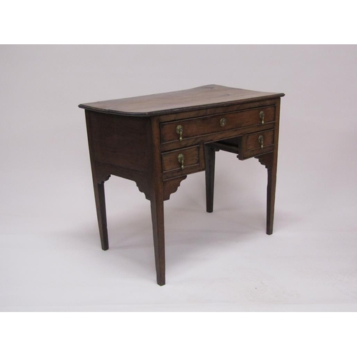 306 - A late Georgian oak and elm country lowboy of rectangular form with one long drawer over two short d... 