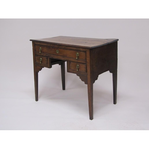 306 - A late Georgian oak and elm country lowboy of rectangular form with one long drawer over two short d... 