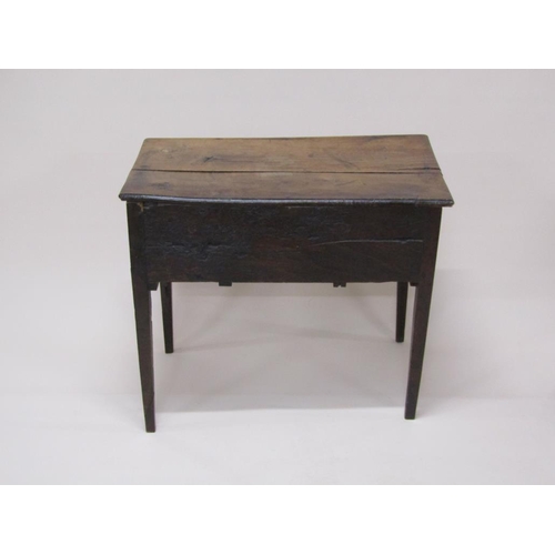 306 - A late Georgian oak and elm country lowboy of rectangular form with one long drawer over two short d... 