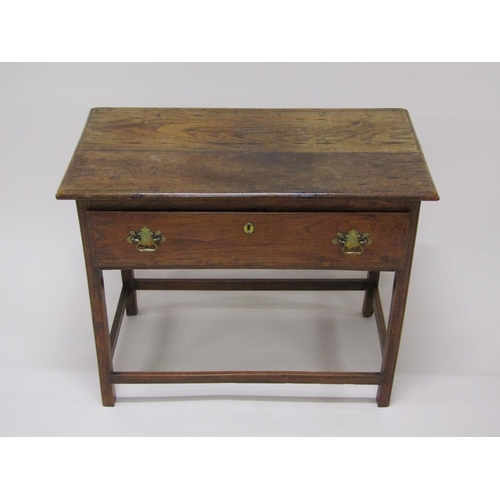 307 - A late Georgian oak panel top side table, fitted one long deep drawer and supported on square chamfe... 