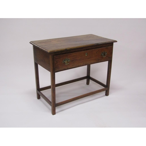 307 - A late Georgian oak panel top side table, fitted one long deep drawer and supported on square chamfe... 