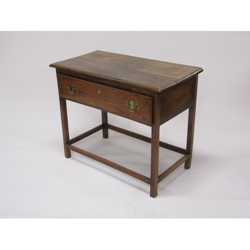 307 - A late Georgian oak panel top side table, fitted one long deep drawer and supported on square chamfe... 