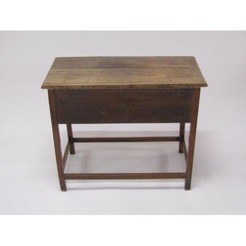 307 - A late Georgian oak panel top side table, fitted one long deep drawer and supported on square chamfe... 