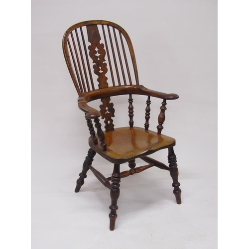 310 - A 19c Yew wood and elm hooped spindle back armchair with pierced vase splats, spindle turned raised ... 