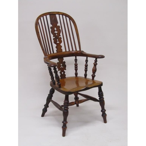 310 - A 19c Yew wood and elm hooped spindle back armchair with pierced vase splats, spindle turned raised ... 