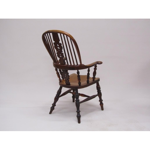 310 - A 19c Yew wood and elm hooped spindle back armchair with pierced vase splats, spindle turned raised ... 