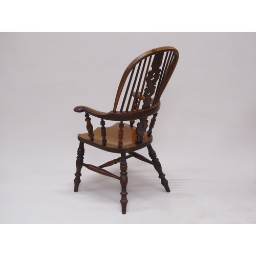 310 - A 19c Yew wood and elm hooped spindle back armchair with pierced vase splats, spindle turned raised ... 